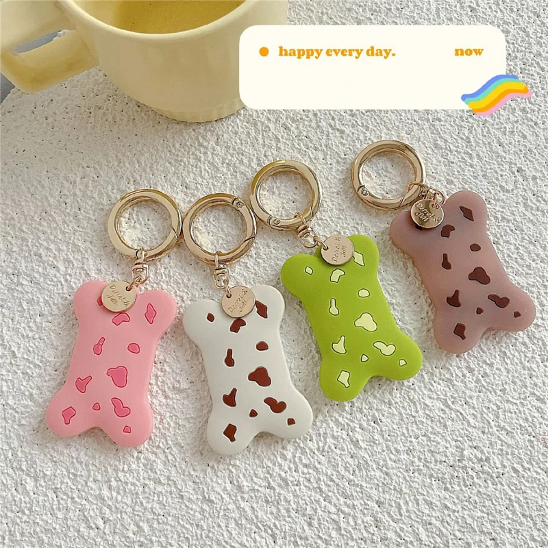 For Apple AirTag Silicone Case Bone-Shaped Cow Print Keychain Protective Cover - Green